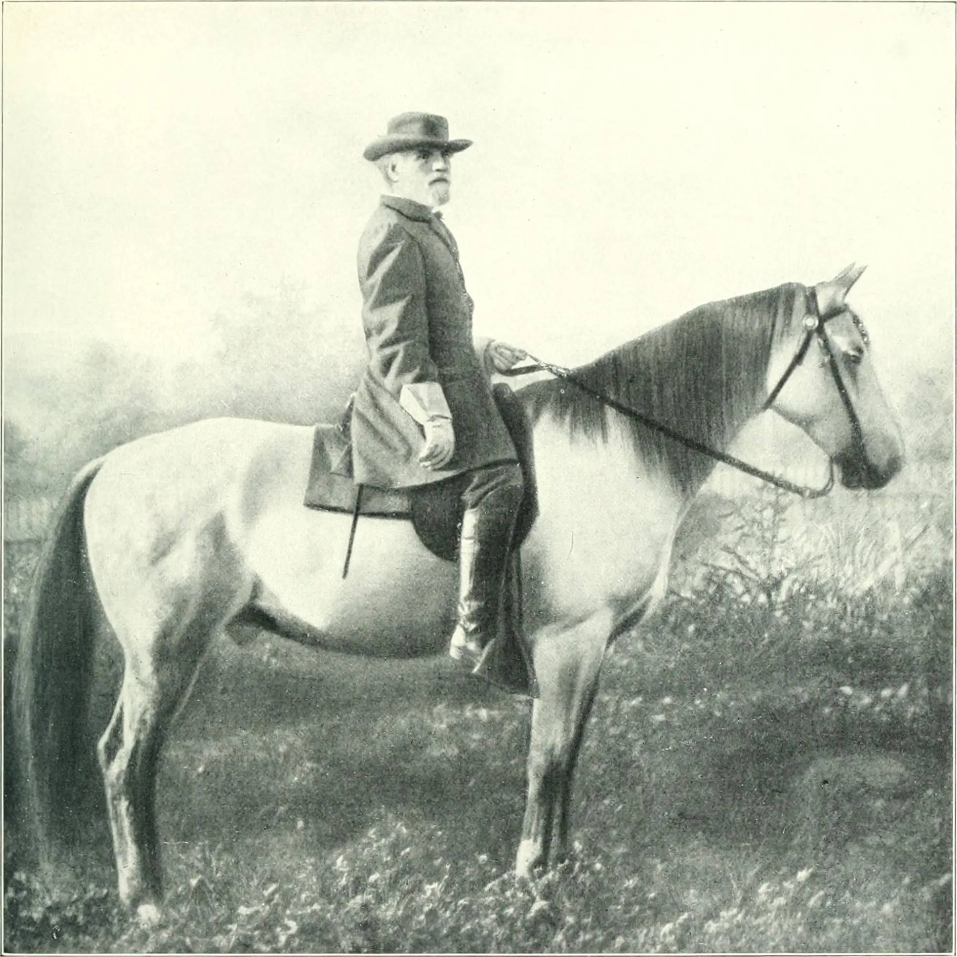 General Robert E. Lee seated upon his grey horse Traveller, in a field with trees in the distance.